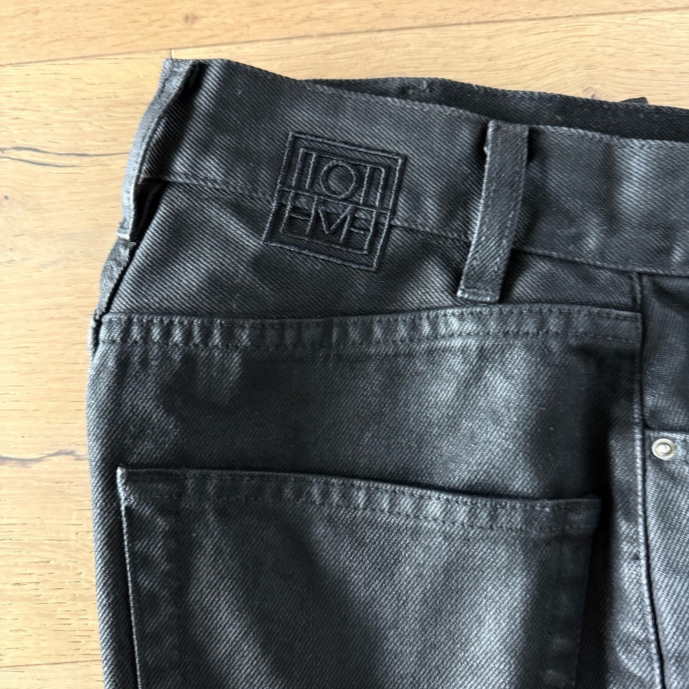 TOTEME Cropped waxed high-rise tapered pants | 23